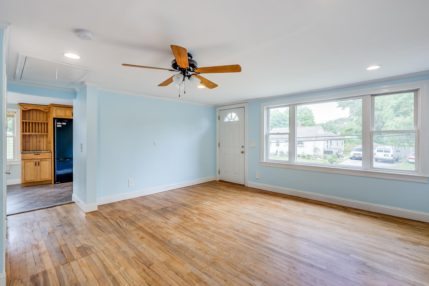 16 Florence Street Monument Beach, MA 02532 - Photo 6 of 35 a view of empty room with wooden floor and fan