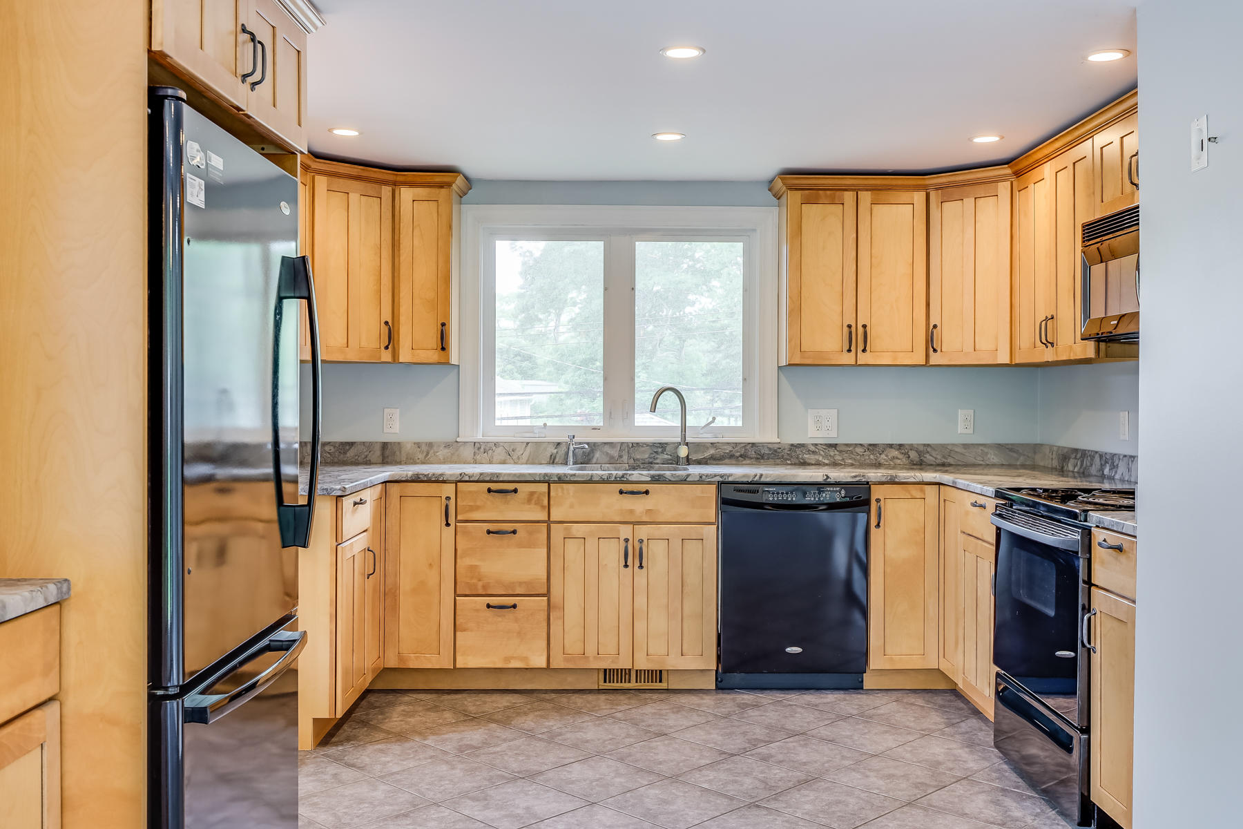 16 Florence Street Monument Beach, MA 02532 - Photo 8 of 35 a kitchen with stainless steel appliances granite countertop a stove a sink and a refrigerator