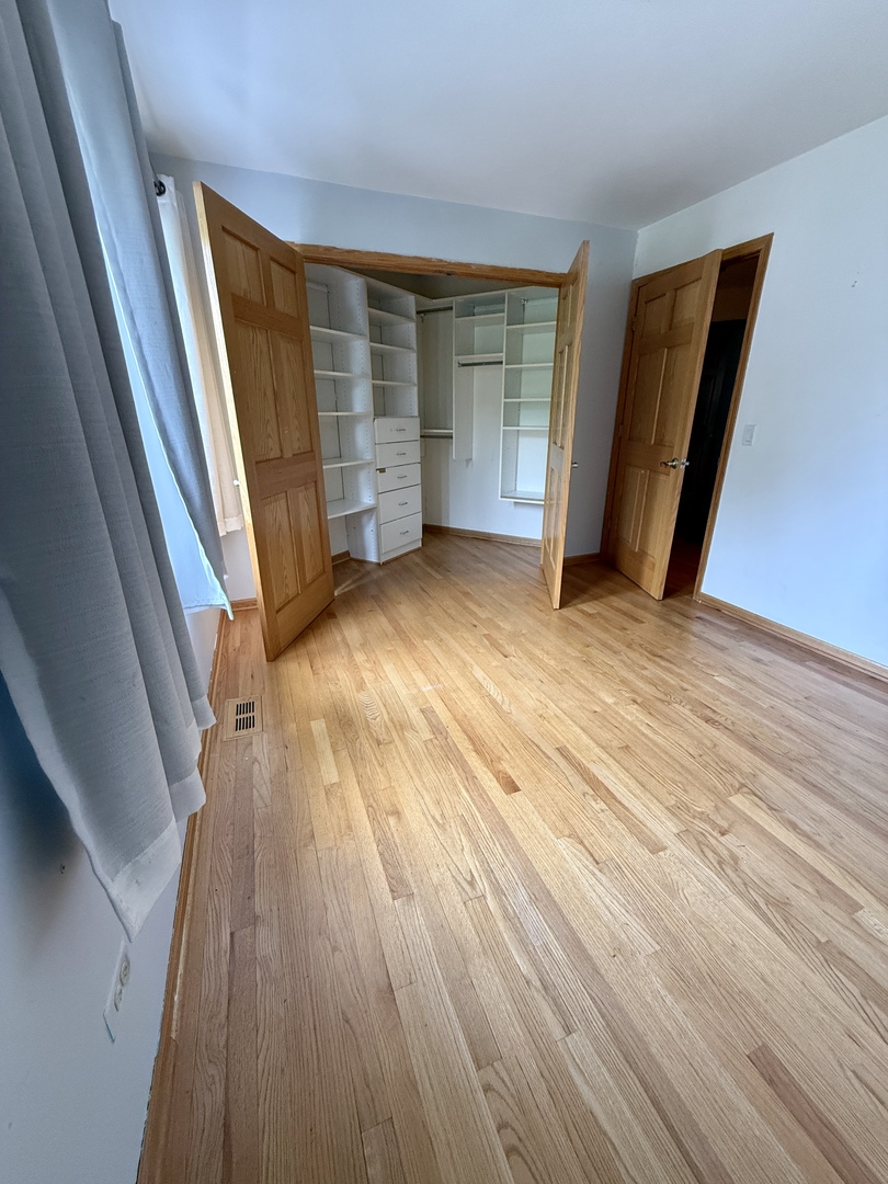 414 South Dee Road Park Ridge, IL 60068 - Photo 21 of 37 a view of empty room with wooden floor