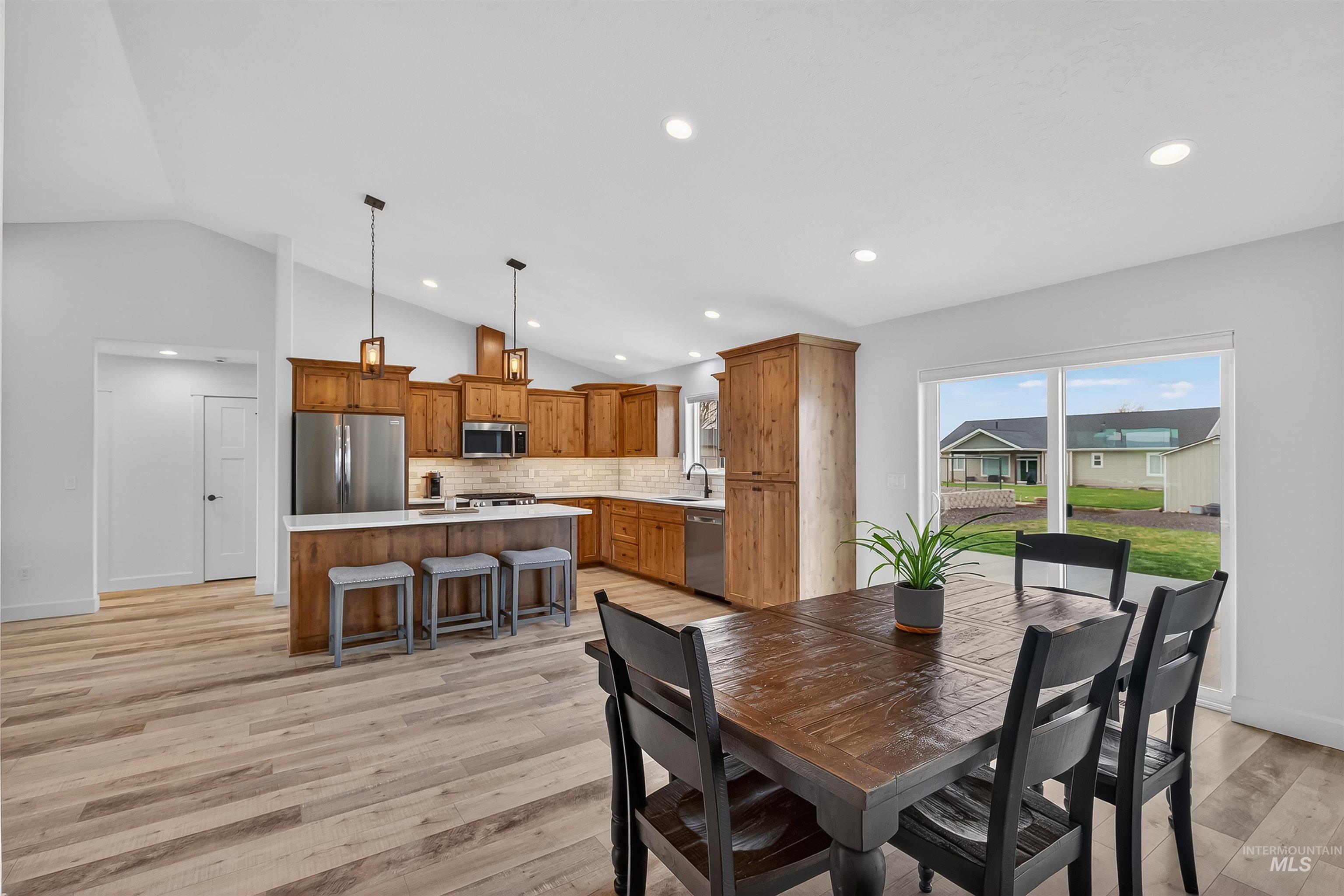 3732 Skyview Drive Lewiston, ID 83501 - Photo 14 of 47 Dining space with light wood-style floors, vaulted ceiling, and recessed lighting
