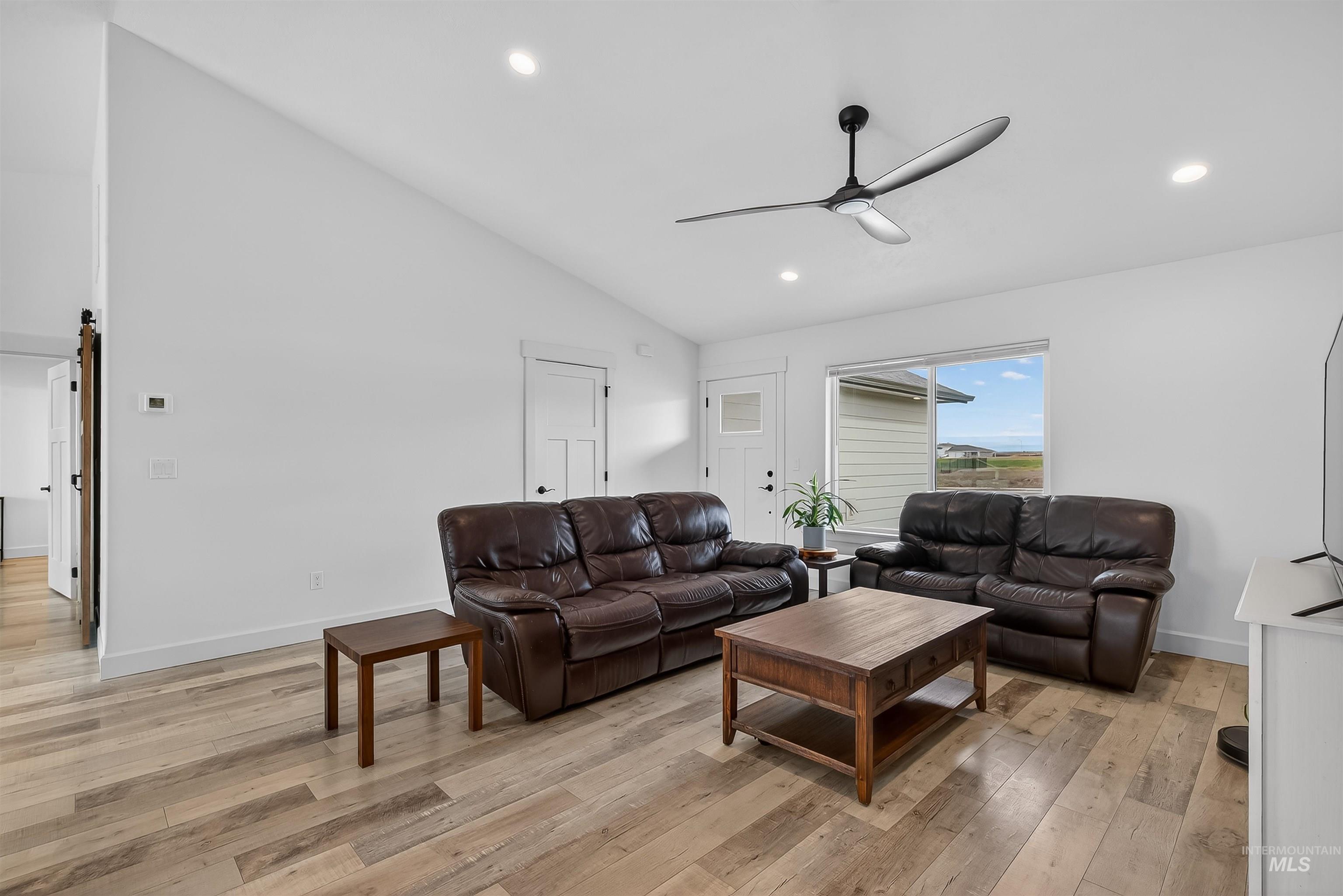 3732 Skyview Drive Lewiston, ID 83501 - Photo 18 of 47 Living area with vaulted ceiling, light wood-type flooring, ceiling fan, and recessed lighting