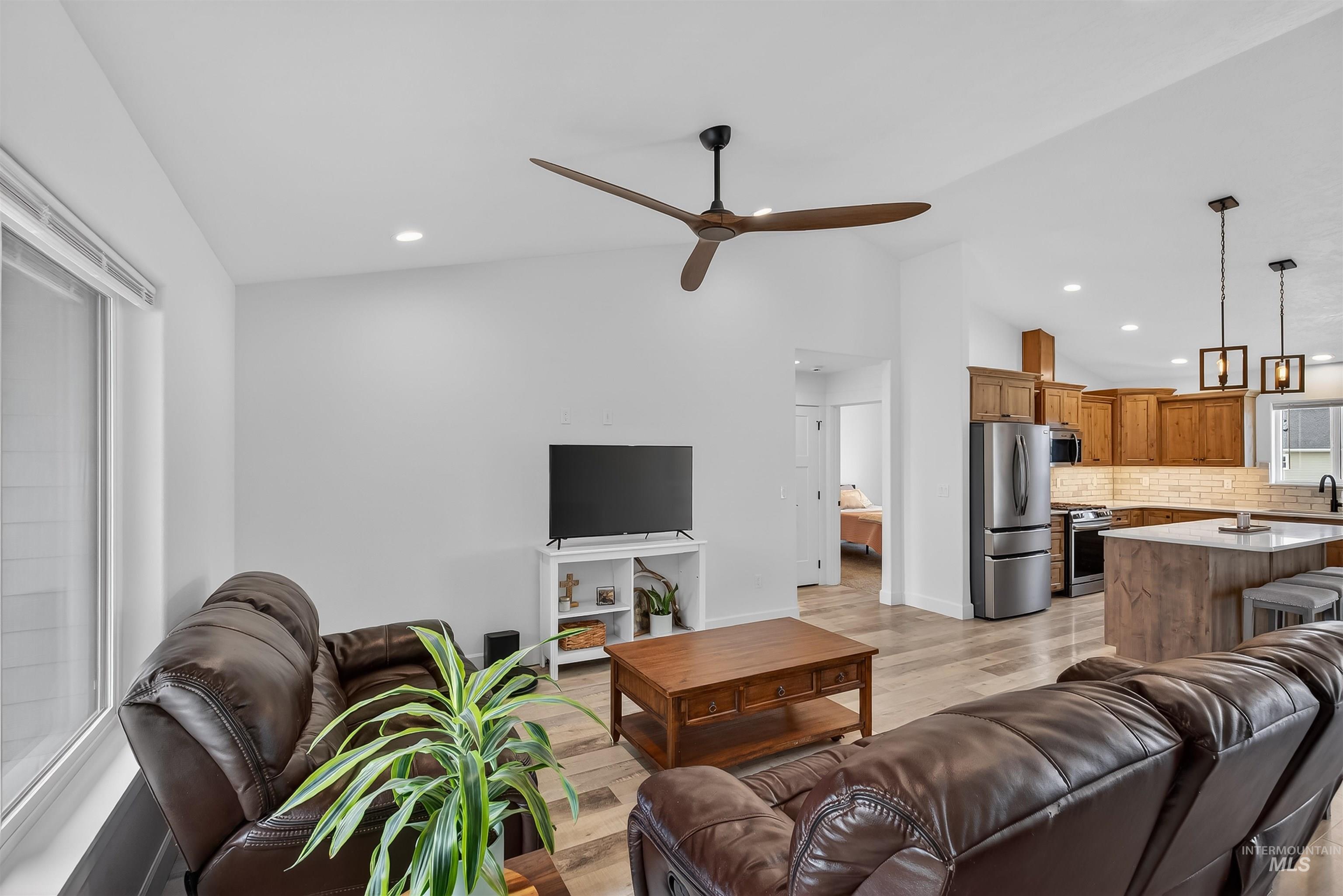 3732 Skyview Drive Lewiston, ID 83501 - Photo 19 of 47 Living area with light wood-style flooring, vaulted ceiling, ceiling fan, and recessed lighting