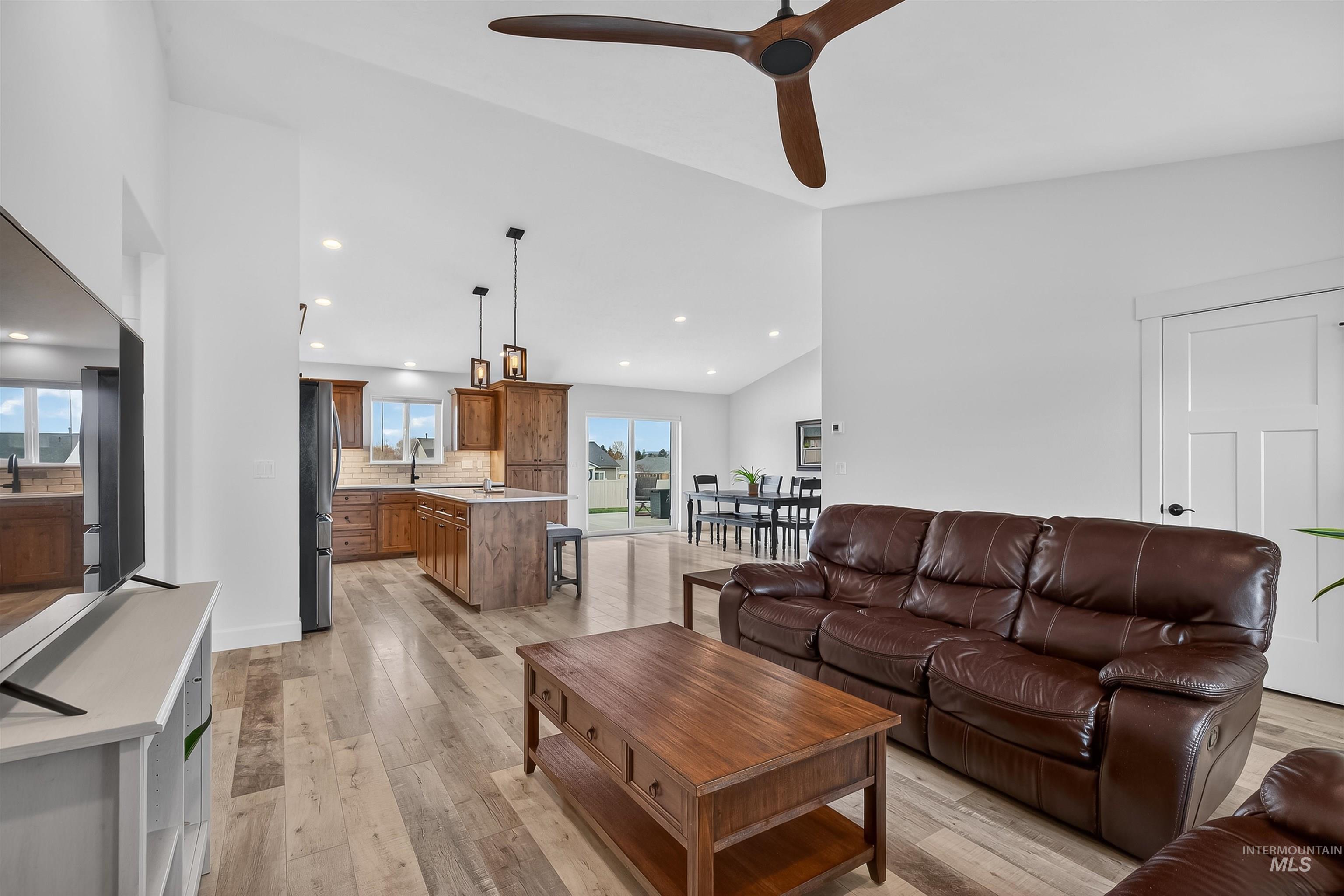 3732 Skyview Drive Lewiston, ID 83501 - Photo 22 of 47 Living room with light wood-type flooring, vaulted ceiling, a ceiling fan, and recessed lighting