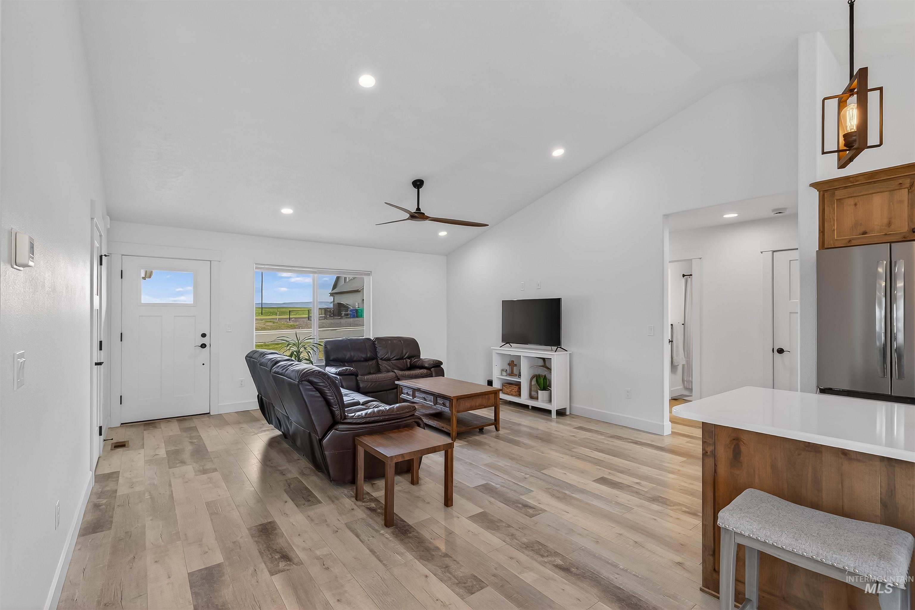 3732 Skyview Drive Lewiston, ID 83501 - Photo 23 of 47 Living area with light wood finished floors, recessed lighting, vaulted ceiling, and a ceiling fan