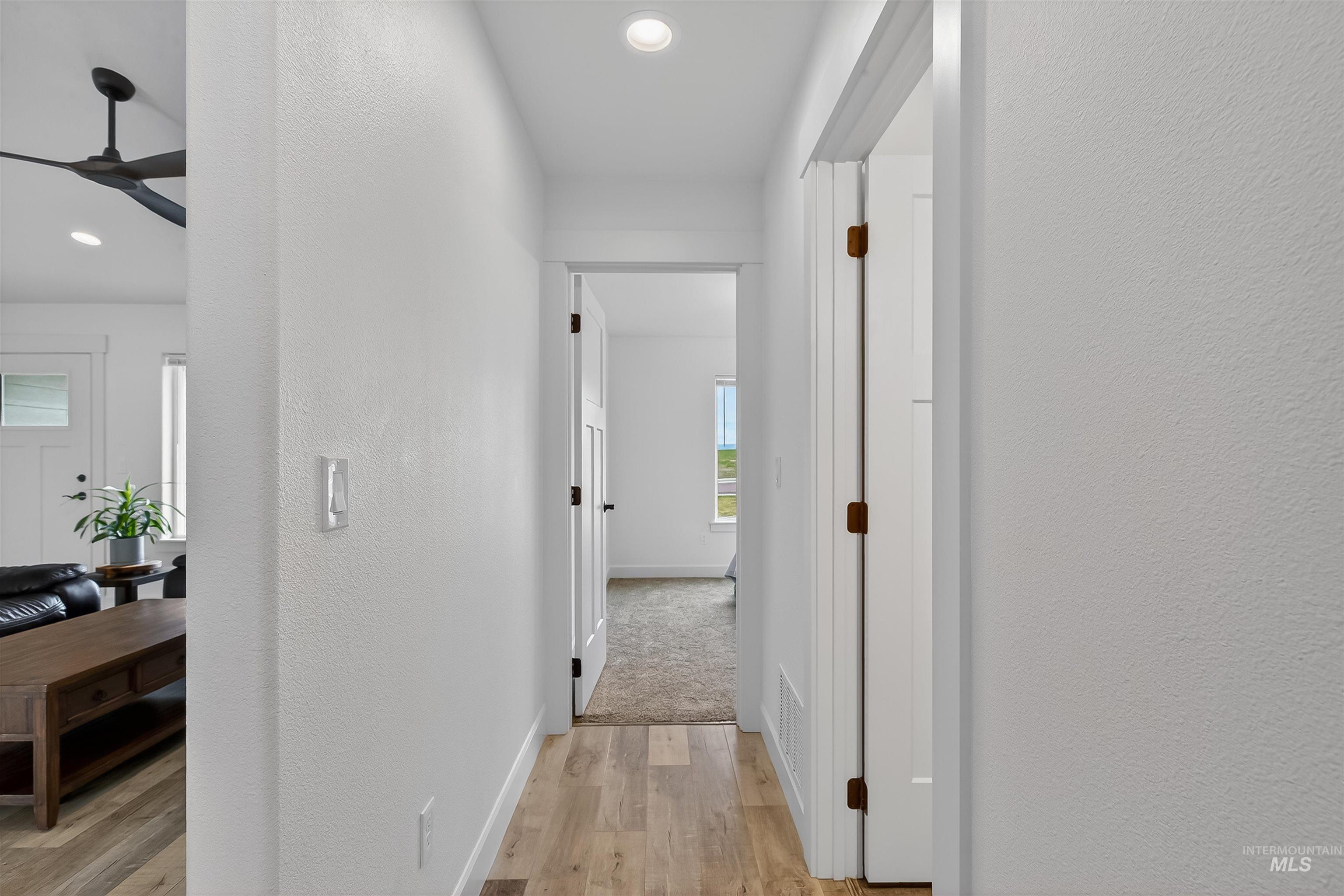 3732 Skyview Drive Lewiston, ID 83501 - Photo 30 of 47 Corridor featuring a textured wall, light wood finished floors, and recessed lighting