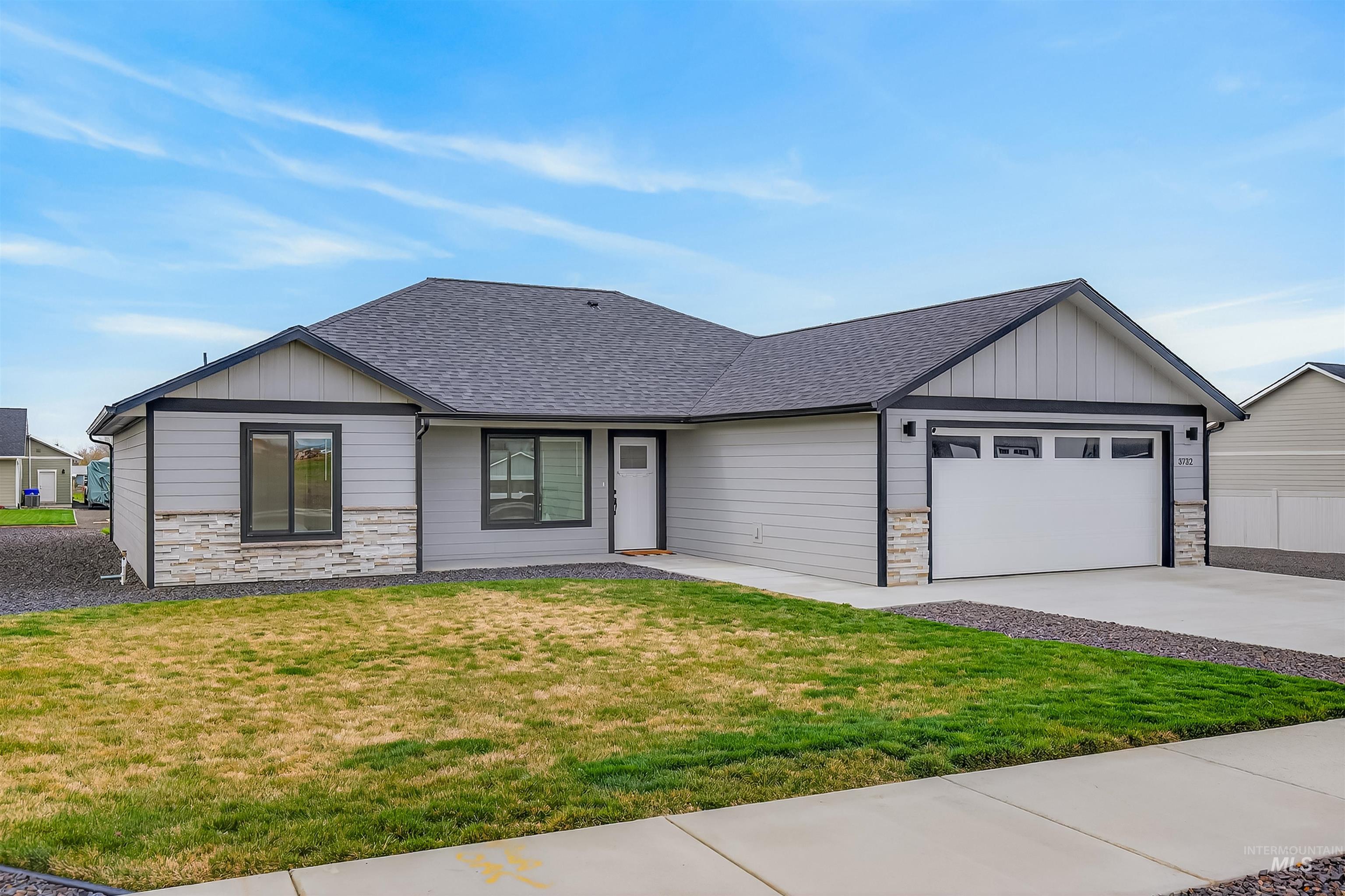 3732 Skyview Drive Lewiston, ID 83501 - Photo 4 of 47 View of front of property featuring stone siding, board and batten siding, a front lawn, and a shingled roof
