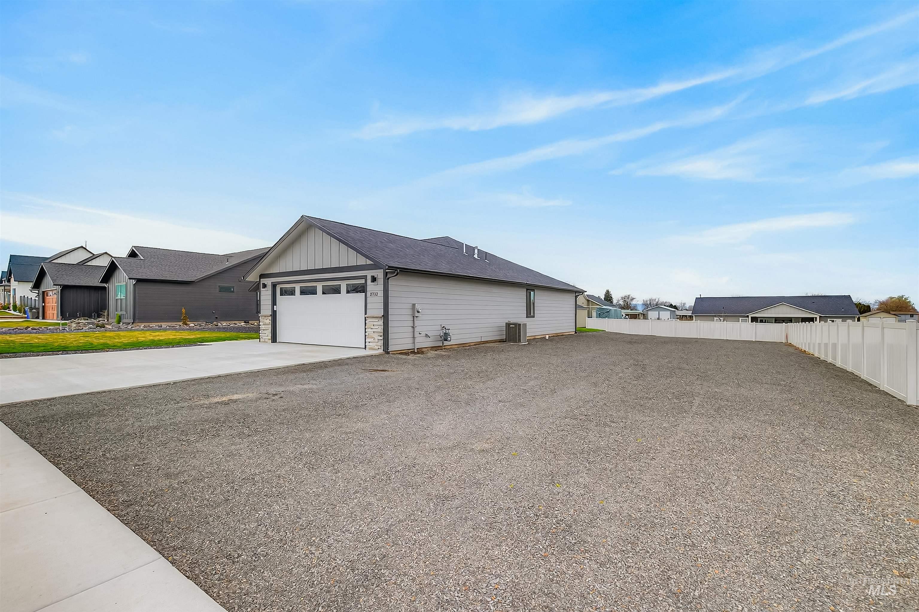 3732 Skyview Drive Lewiston, ID 83501 - Photo 46 of 47 View of side of property with concrete driveway, stone siding, and board and batten siding