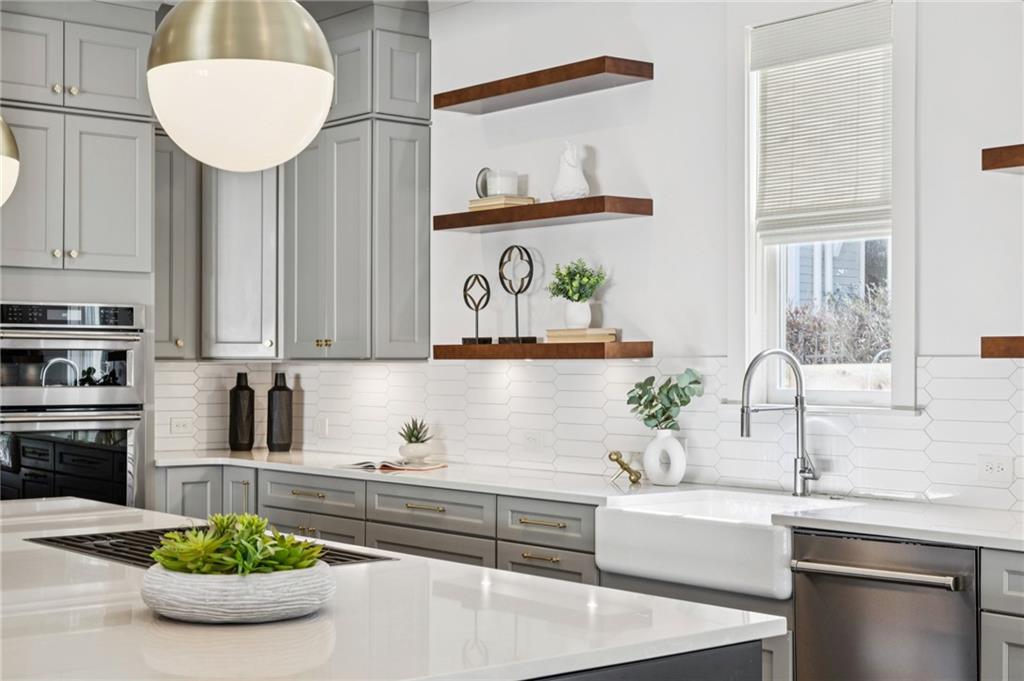 216 Haralson Lane Atlanta, GA 30307 - Photo 12 of 48 a kitchen with a sink and a stove