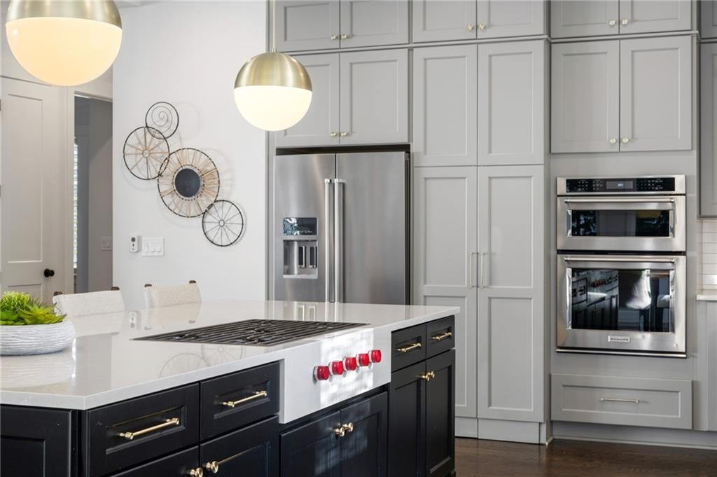 216 Haralson Lane Atlanta, GA 30307 - Photo 14 of 48 a kitchen with stainless steel appliances granite countertop a stove a refrigerator and a microwave