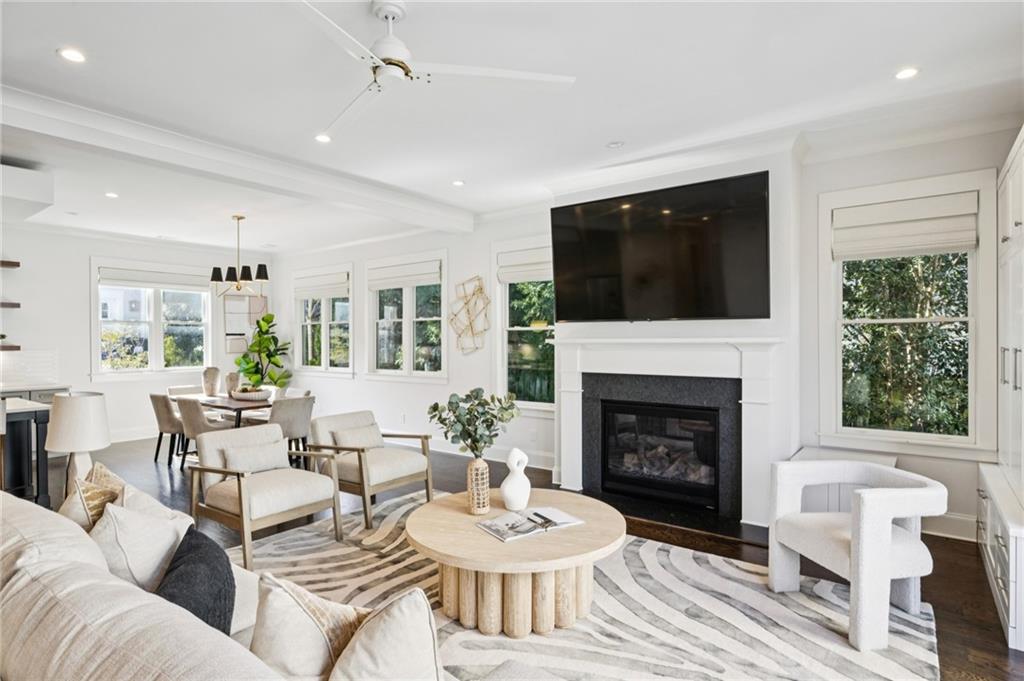216 Haralson Lane Atlanta, GA 30307 - Photo 19 of 48 a living room with furniture a fireplace and a flat screen tv