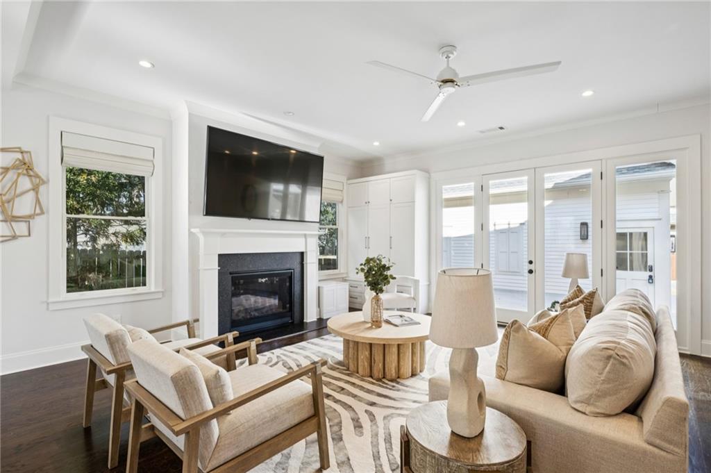 216 Haralson Lane Atlanta, GA 30307 - Photo 20 of 48 a living room with furniture a fireplace and a flat screen tv