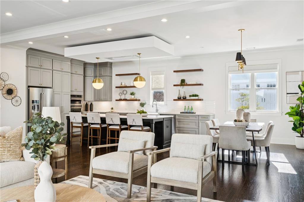 216 Haralson Lane Atlanta, GA 30307 - Photo 22 of 48 a living room with lots of furniture and kitchen view