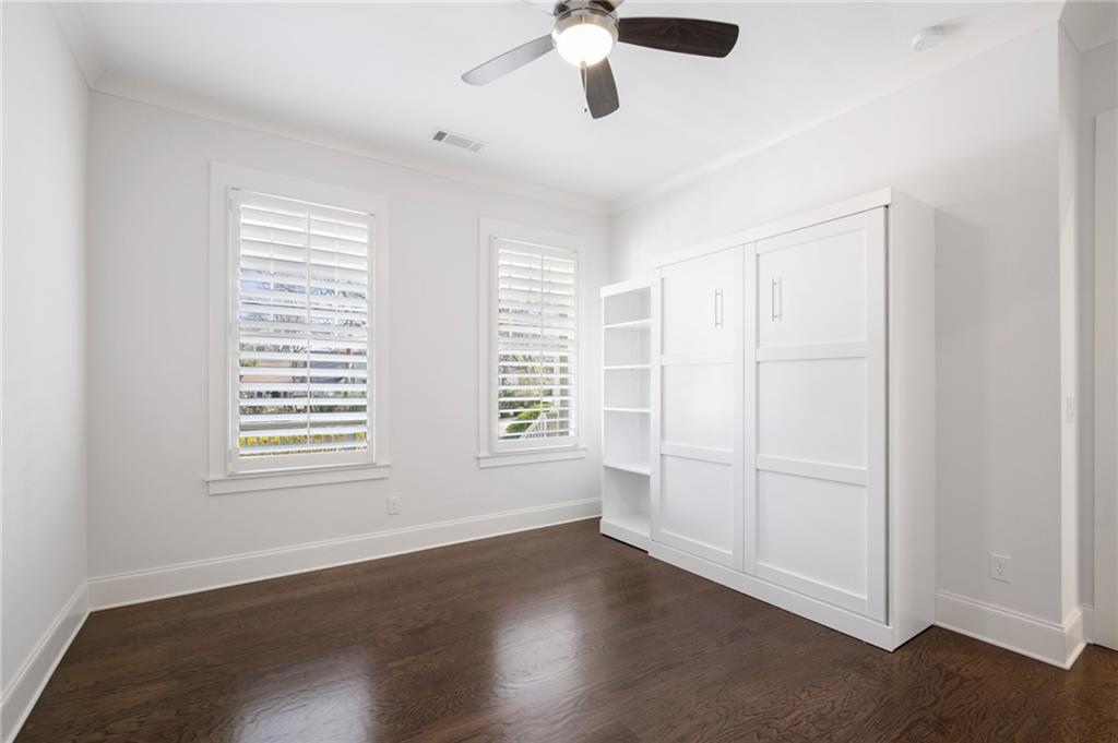 216 Haralson Lane Atlanta, GA 30307 - Photo 24 of 48 a view of an empty room with wooden floor and a window