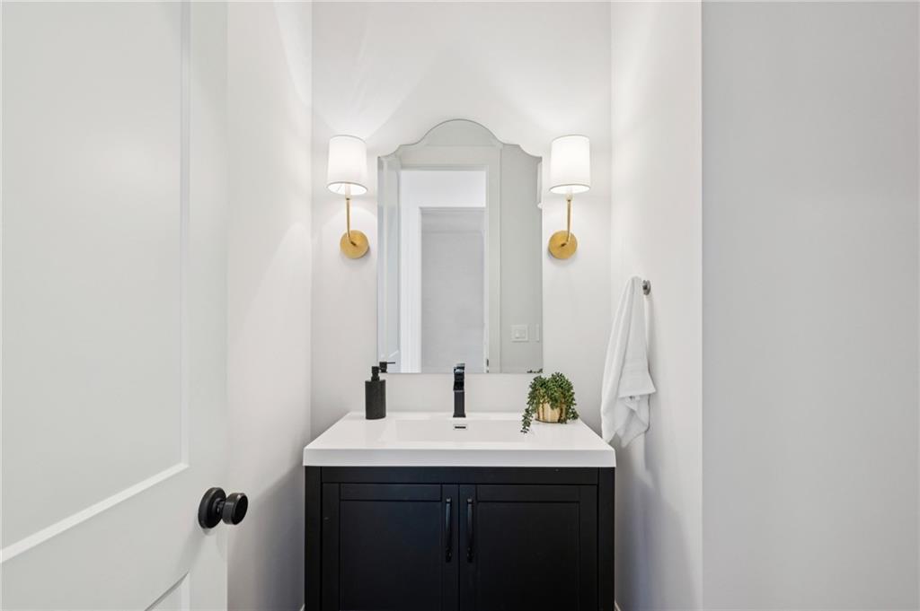 216 Haralson Lane Atlanta, GA 30307 - Photo 26 of 48 a bathroom with a sink and a mirror