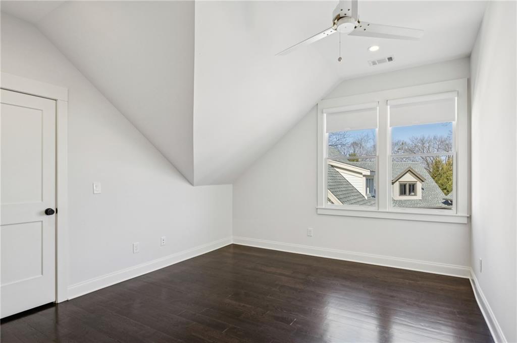 216 Haralson Lane Atlanta, GA 30307 - Photo 30 of 48 a view of an empty room with wooden floor and a window