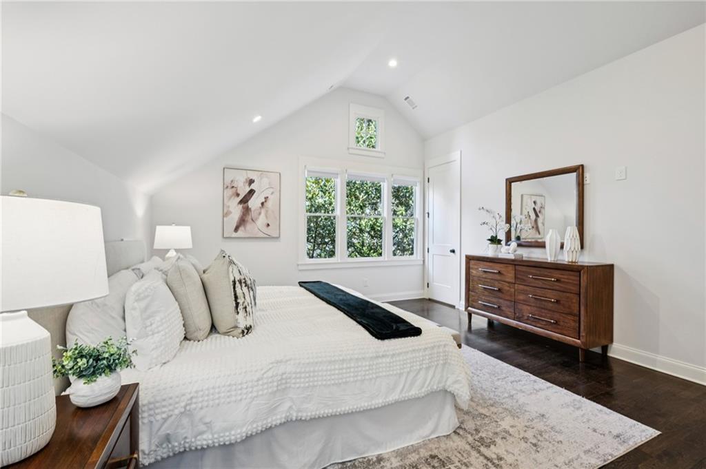 216 Haralson Lane Atlanta, GA 30307 - Photo 35 of 48 a bedroom with a bed and a dresser