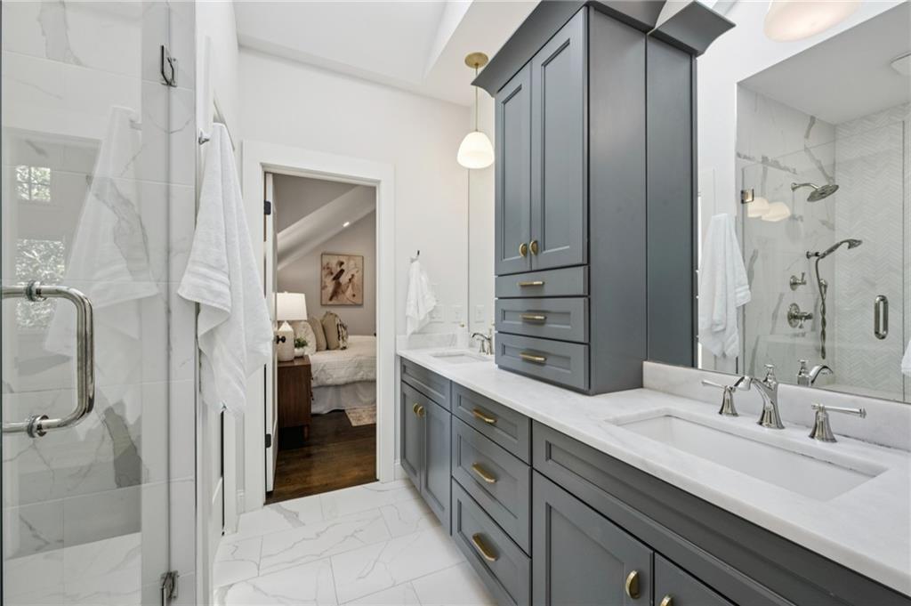 216 Haralson Lane Atlanta, GA 30307 - Photo 38 of 48 a spacious bathroom with a double vanity sink and a mirror