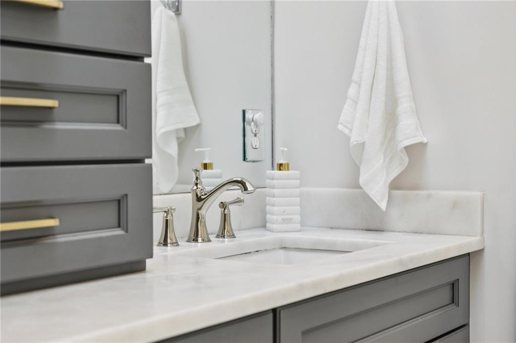 216 Haralson Lane Atlanta, GA 30307 - Photo 39 of 48 a bathroom with a sink and a mirror