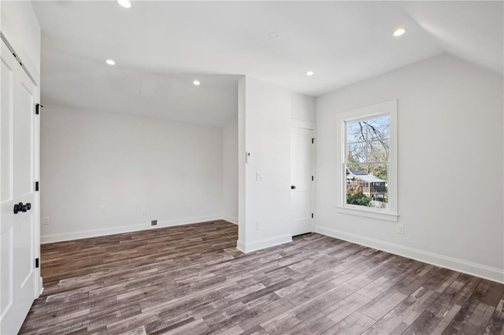 216 Haralson Lane Atlanta, GA 30307 - Photo 45 of 48 an empty room with wooden floor and windows