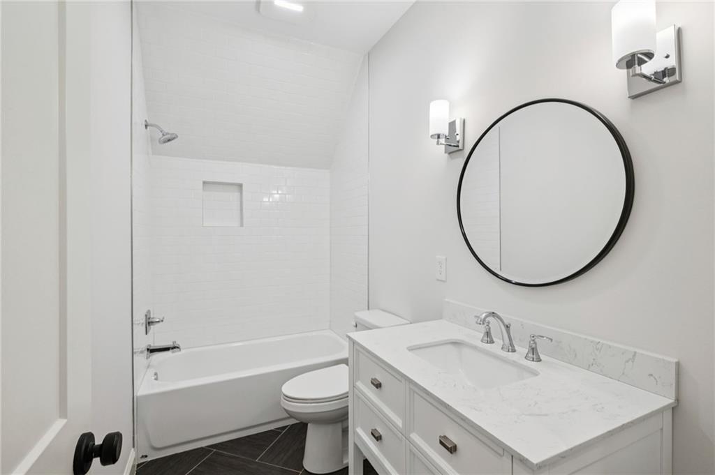 216 Haralson Lane Atlanta, GA 30307 - Photo 46 of 48 a bathroom with a sink a toilet and a mirror