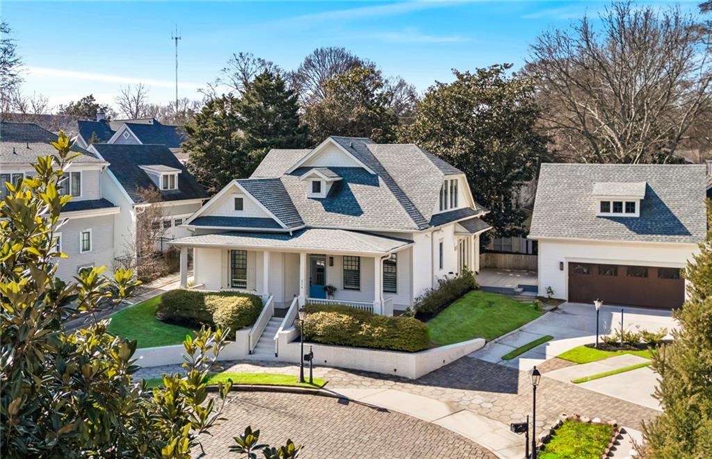216 Haralson Lane Atlanta, GA 30307 - Photo 48 of 48 a front view of house with yard and trees in the background