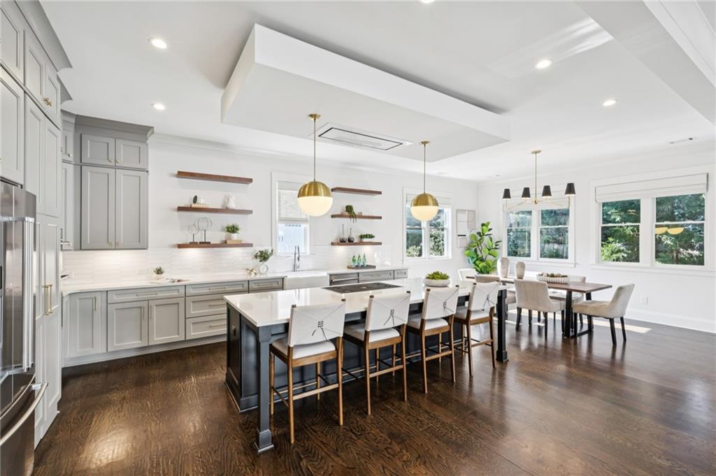 216 Haralson Lane Atlanta, GA 30307 - Photo 5 of 48 a kitchen with lots of wooden furniture appliances and dining table
