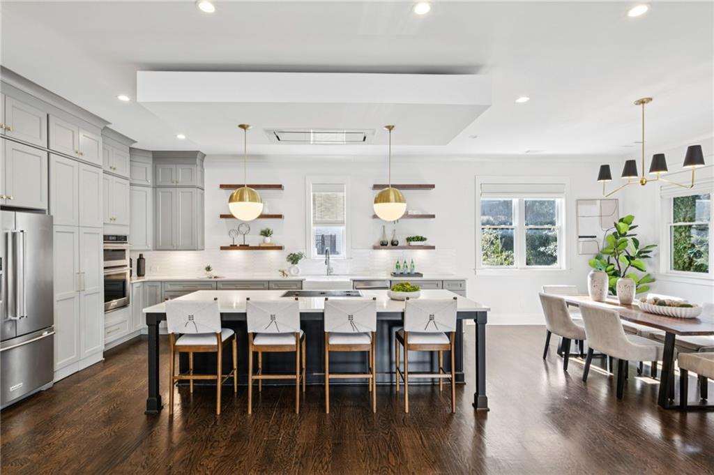 216 Haralson Lane Atlanta, GA 30307 - Photo 6 of 48 a view of a dining room with furniture wooden floor and kitchen view