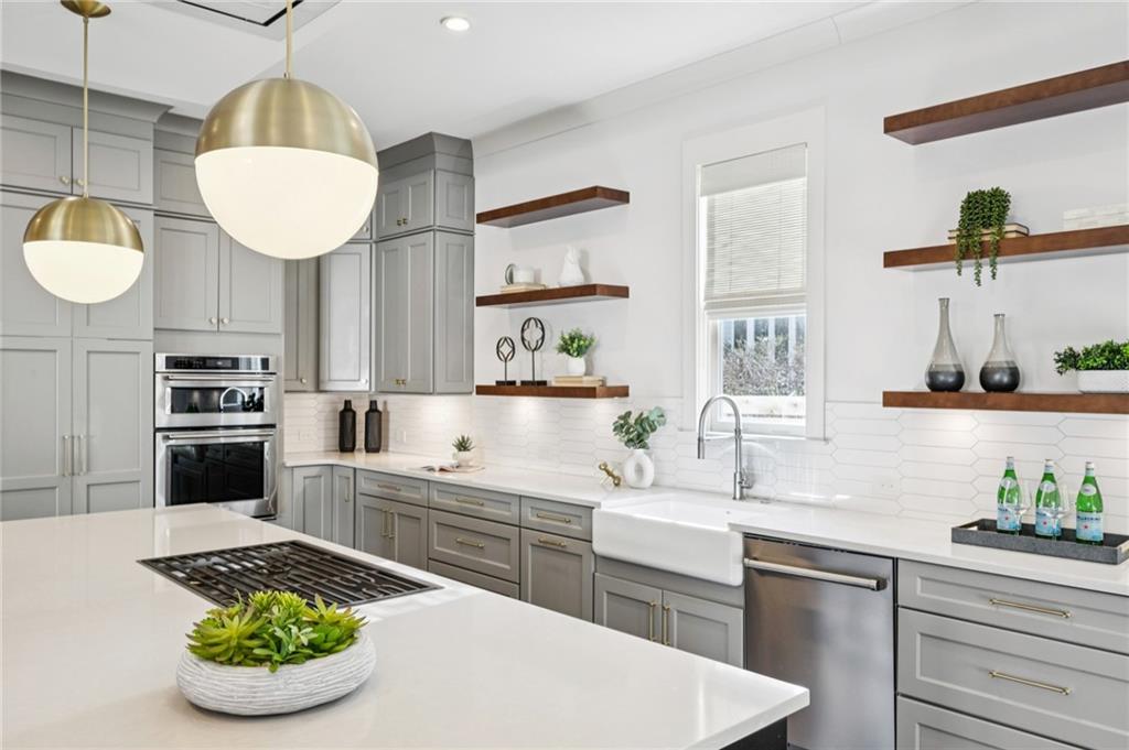216 Haralson Lane Atlanta, GA 30307 - Photo 8 of 48 a kitchen with a sink and a stove