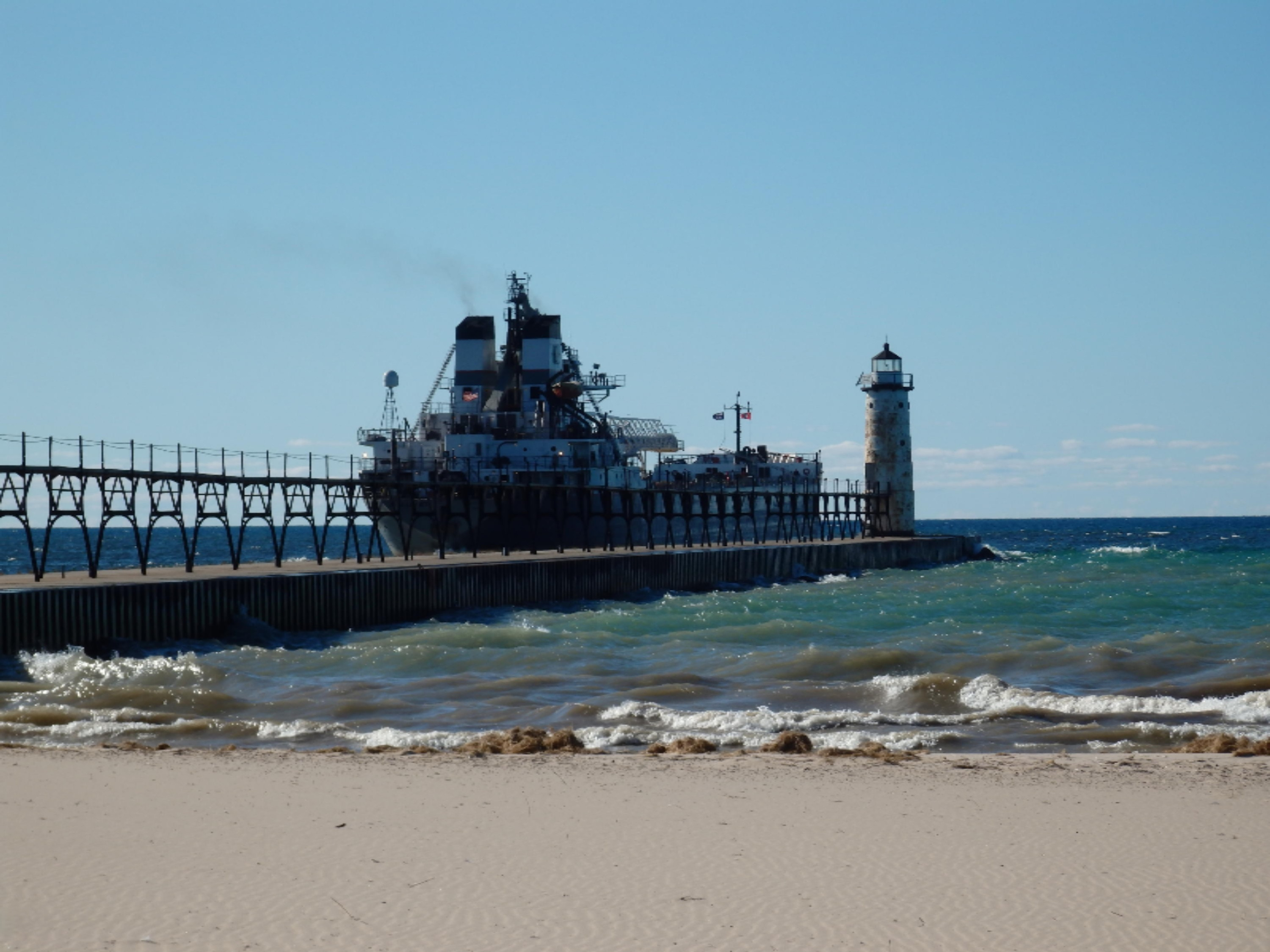 772 Red Apple Road Manistee, MI 49660 - Photo 85 of 110 Freighter leaving Manistee harbor