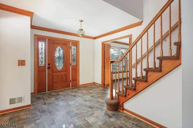 a view of empty room with a fireplace