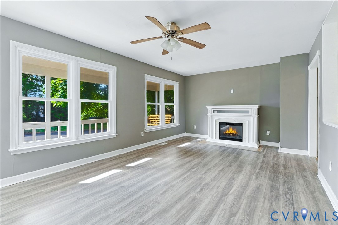7705 Offshore Drive Chesterfield, VA 23832 - Photo 13 of 39 a view of an empty room with wooden floor and a window