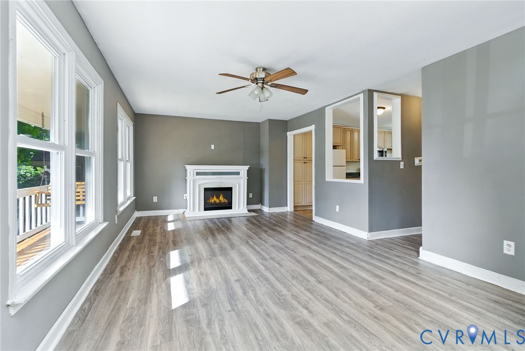 7705 Offshore Drive Chesterfield, VA 23832 - Photo 14 of 39 wooden floor fireplace and windows in an empty room