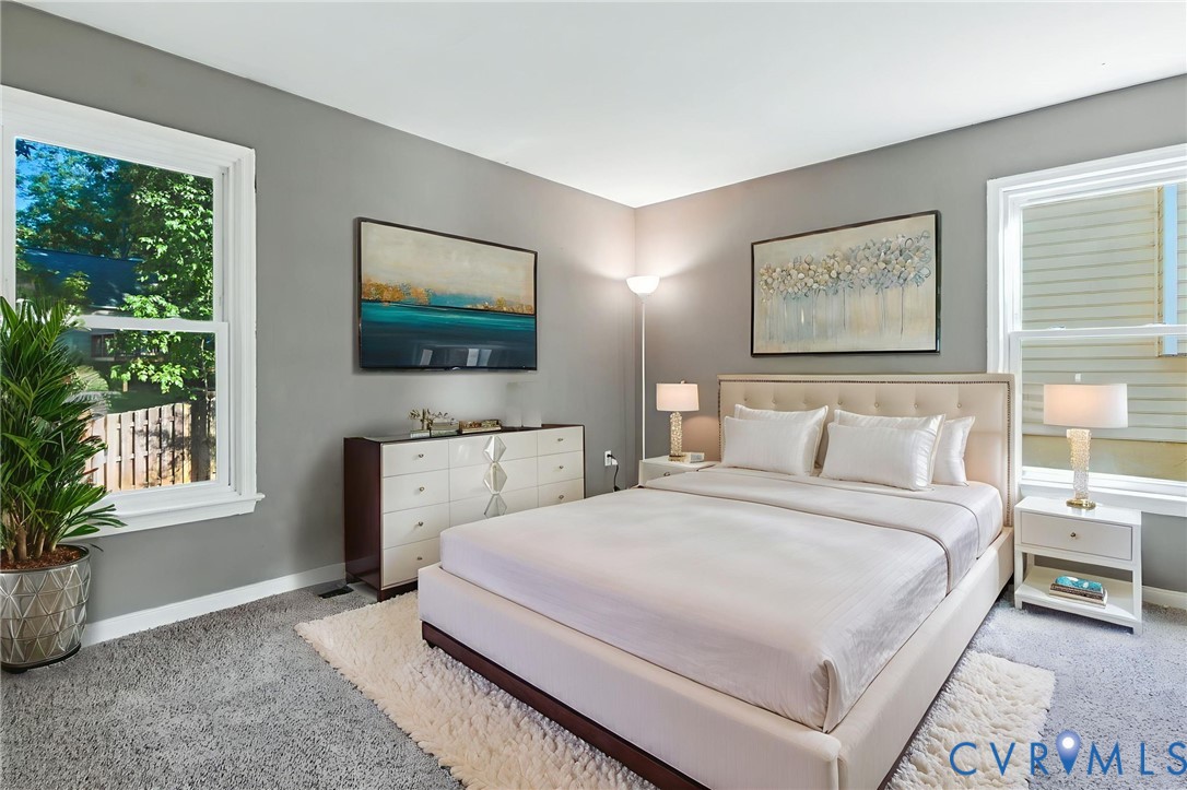 7705 Offshore Drive Chesterfield, VA 23832 - Photo 21 of 39 a bedroom with a bed a rug and a window