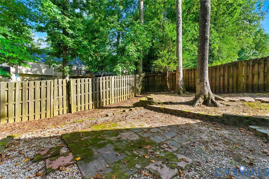 7705 Offshore Drive Chesterfield, VA 23832 - Photo 39 of 39 a view of a wooden fence with large trees and wooden fence