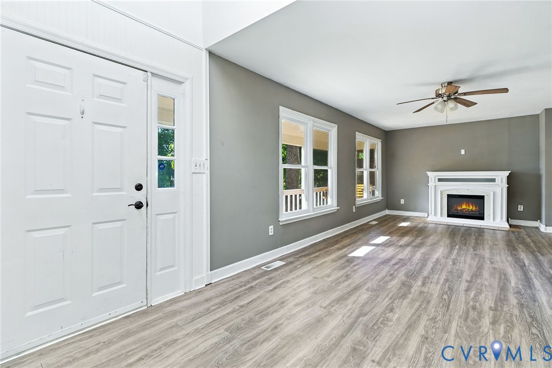 7705 Offshore Drive Chesterfield, VA 23832 - Photo 10 of 39 a view of empty room with wooden floor and fireplace