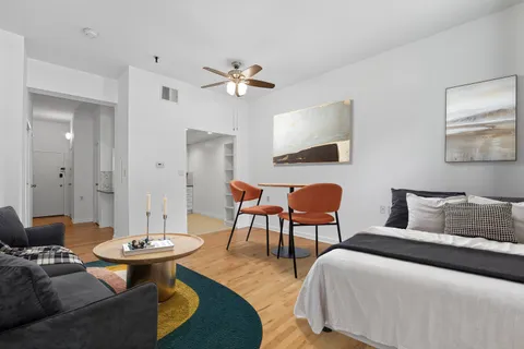 a bedroom with a bed and a table