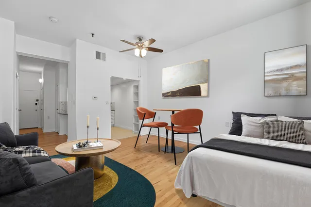 a bedroom with a bed and a table