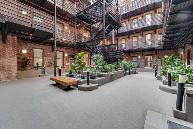 a view of a chairs and table in a patio