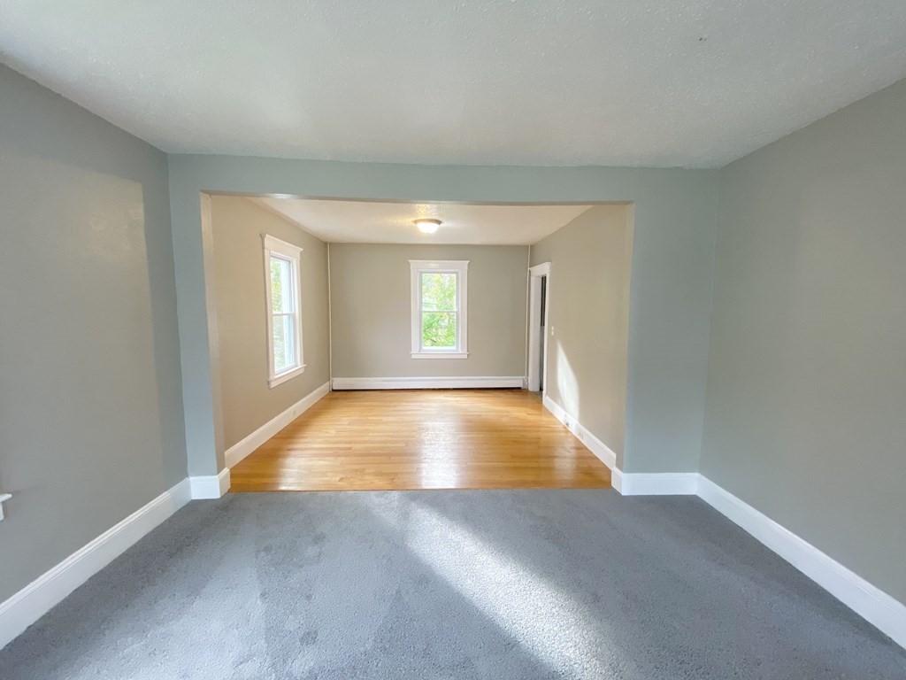 48 Boyer Street Springfield, MA 01109 - Photo 17 of 30 wooden floor in an empty room with a window