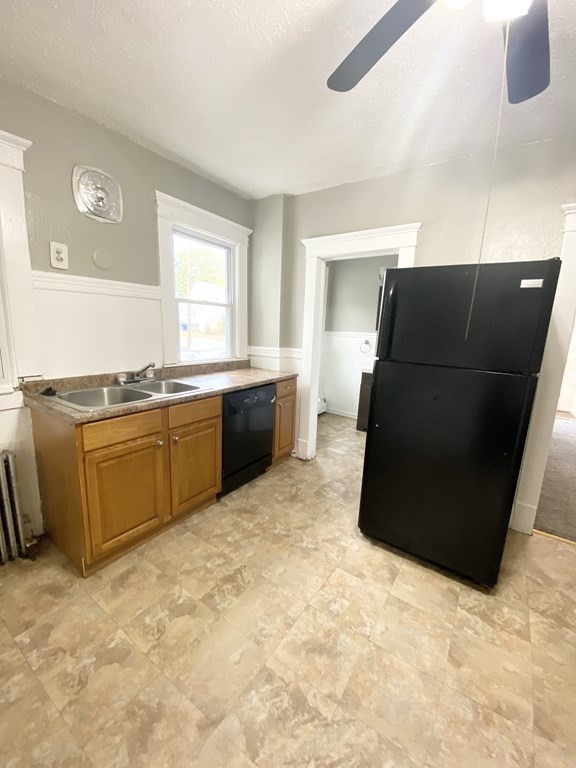 48 Boyer Street Springfield, MA 01109 - Photo 19 of 30 a kitchen with a stove and a refrigerator