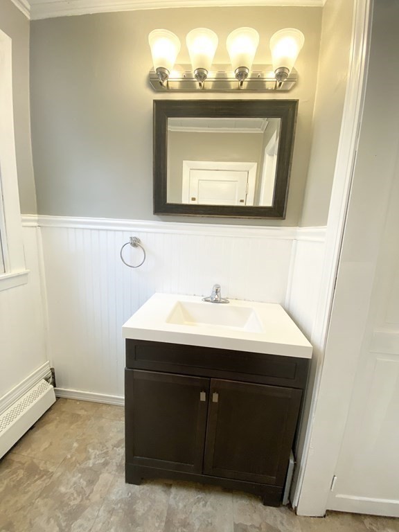 48 Boyer Street Springfield, MA 01109 - Photo 23 of 30 a bathroom with a sink a mirror and a vanity