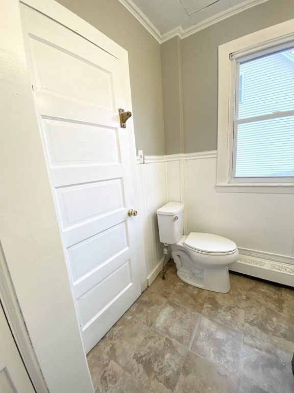 48 Boyer Street Springfield, MA 01109 - Photo 24 of 30 a white toilet sitting next to a bathroom sink