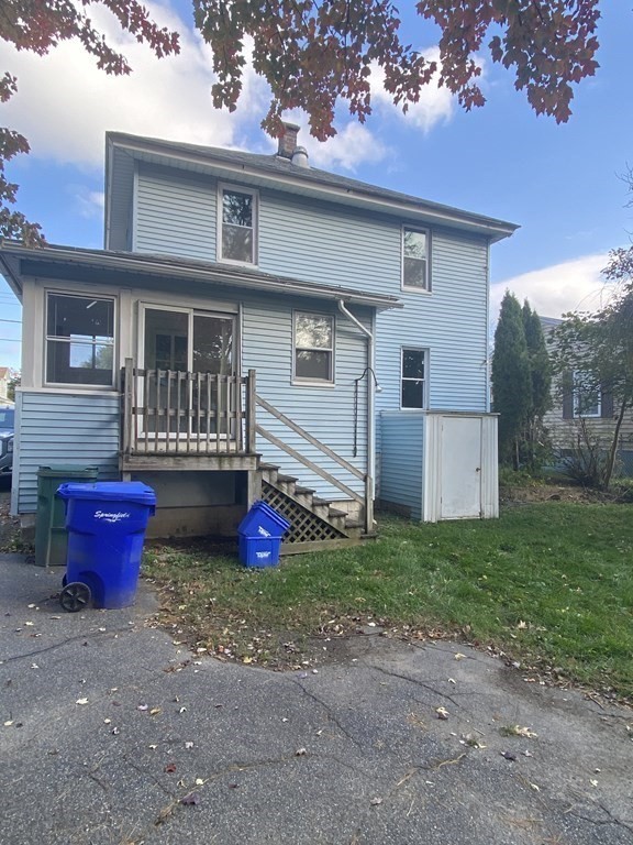 48 Boyer Street Springfield, MA 01109 - Photo 3 of 30 a view of a house with yard and chairs in front of house