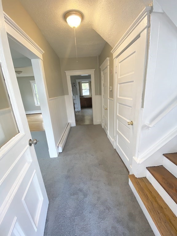 48 Boyer Street Springfield, MA 01109 - Photo 5 of 30 a view of a livingroom with wooden floor and stairs