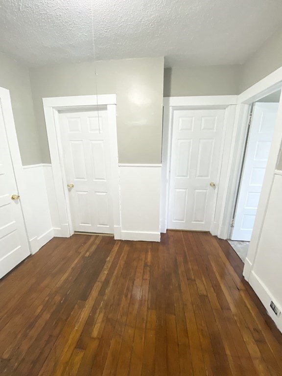48 Boyer Street Springfield, MA 01109 - Photo 8 of 30 a view of an empty room with wooden floor and a window