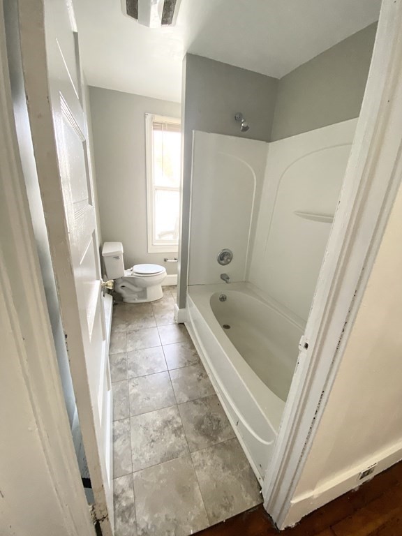 48 Boyer Street Springfield, MA 01109 - Photo 9 of 30 a bathroom with a tub shower and a sink