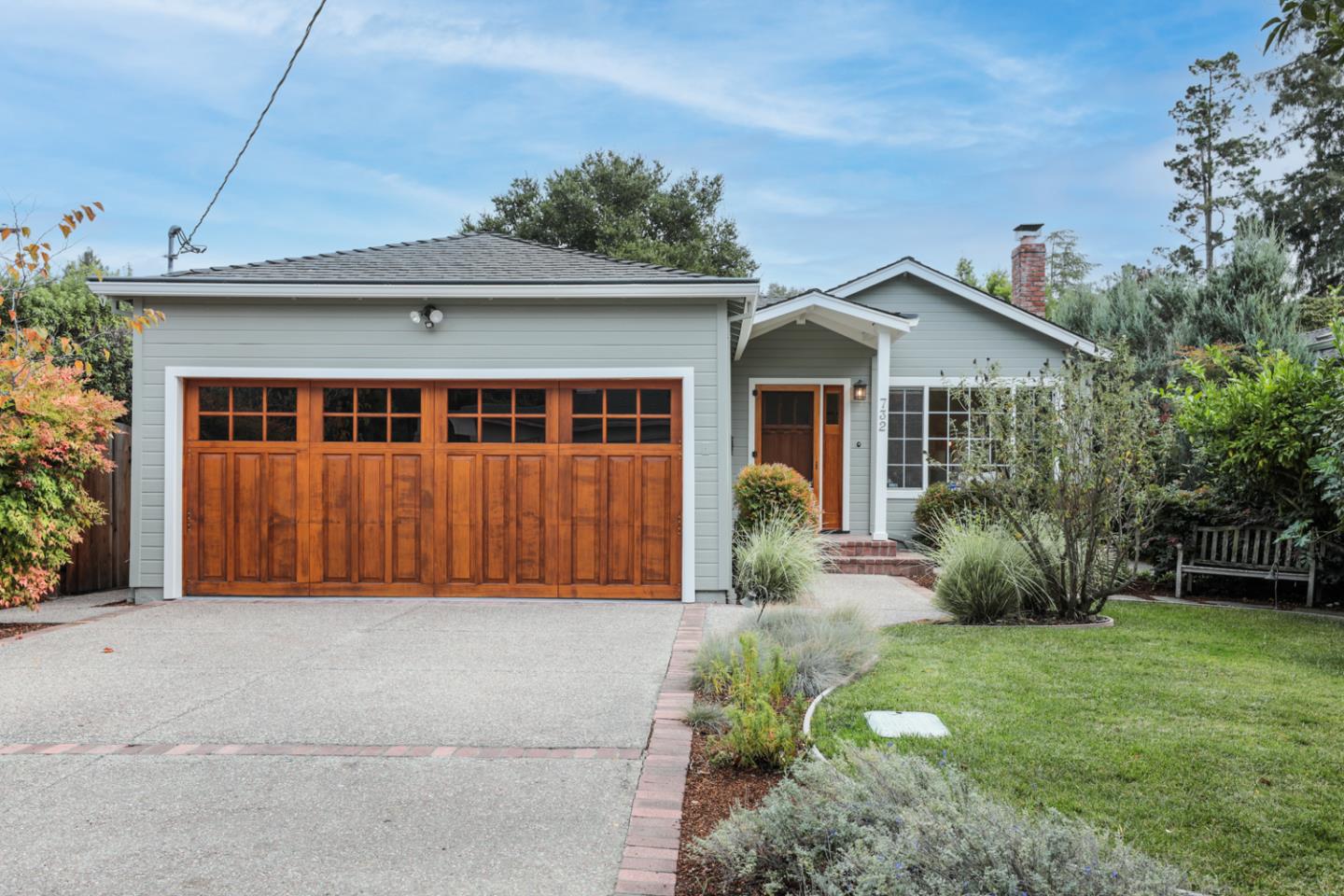 732 Laurel Avenue Menlo Park, CA 94025 - Photo 1 of 22 a view of a house with a yard and potted plants
