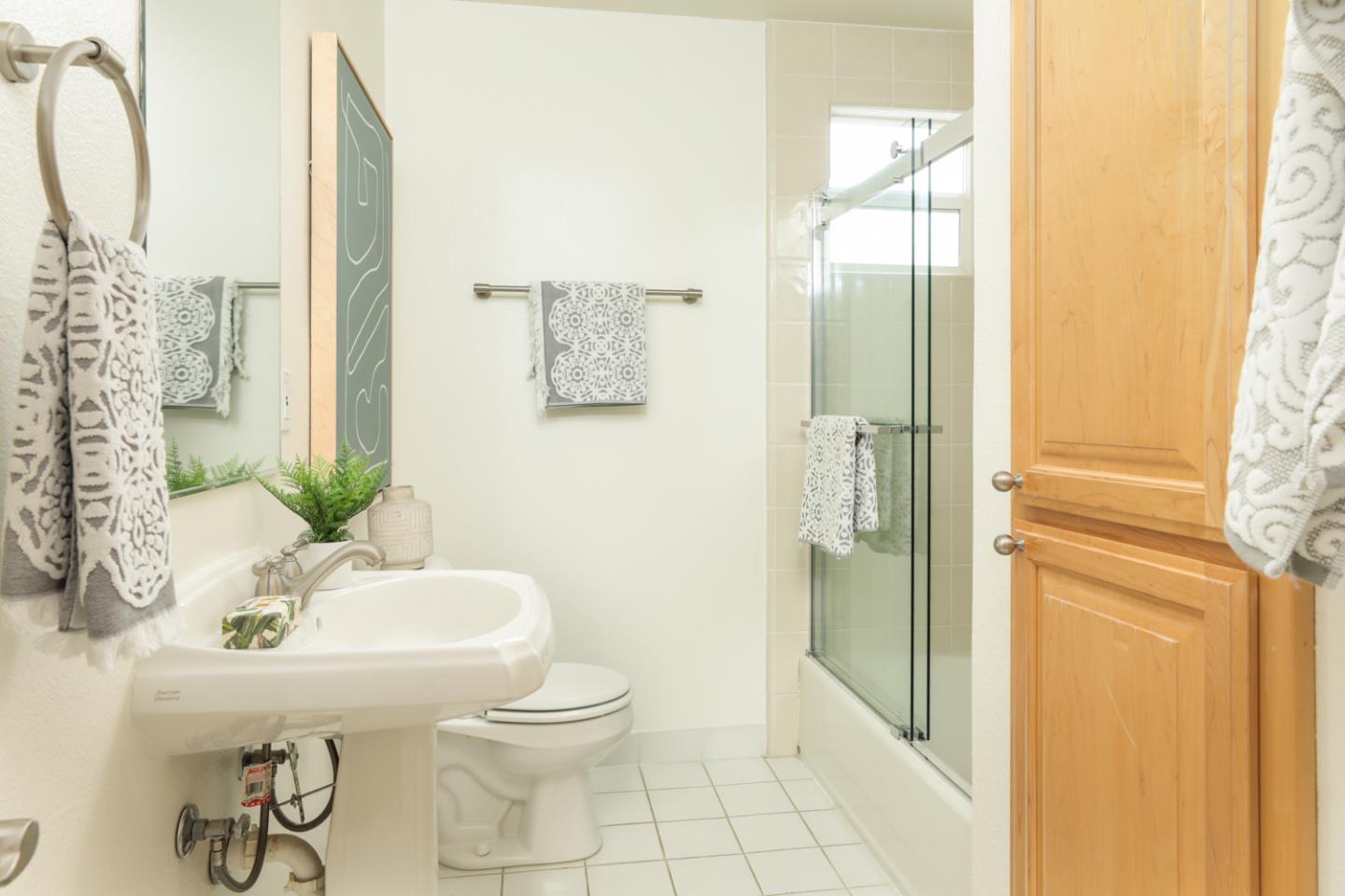 732 Laurel Avenue Menlo Park, CA 94025 - Photo 12 of 22 a bathroom with a sink toilet and shower