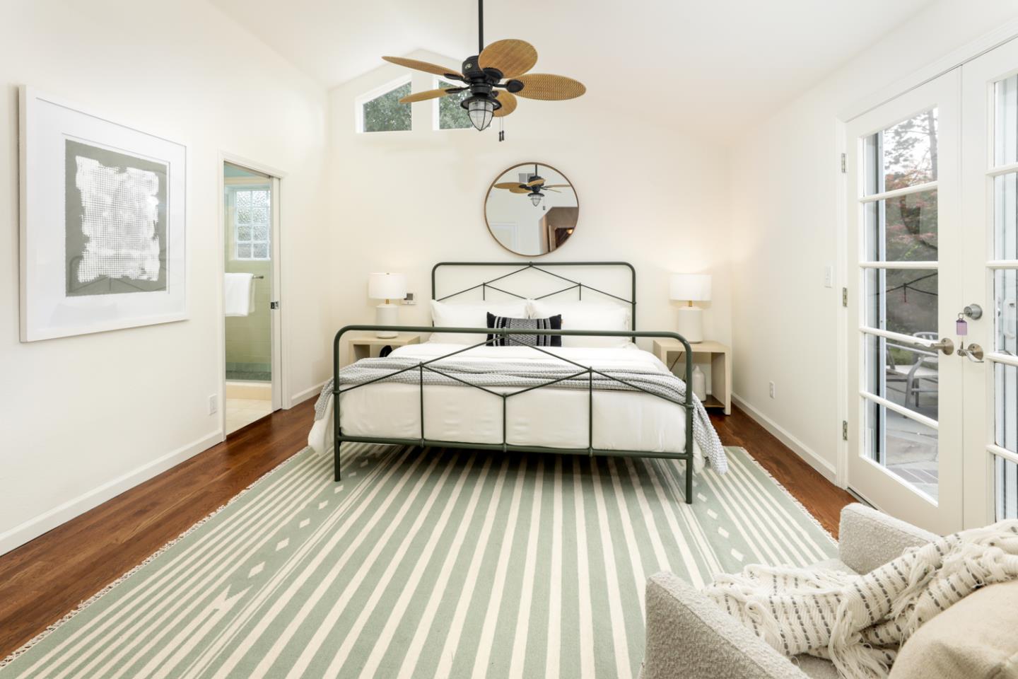 732 Laurel Avenue Menlo Park, CA 94025 - Photo 13 of 22 a bedroom with a bed and wooden floor