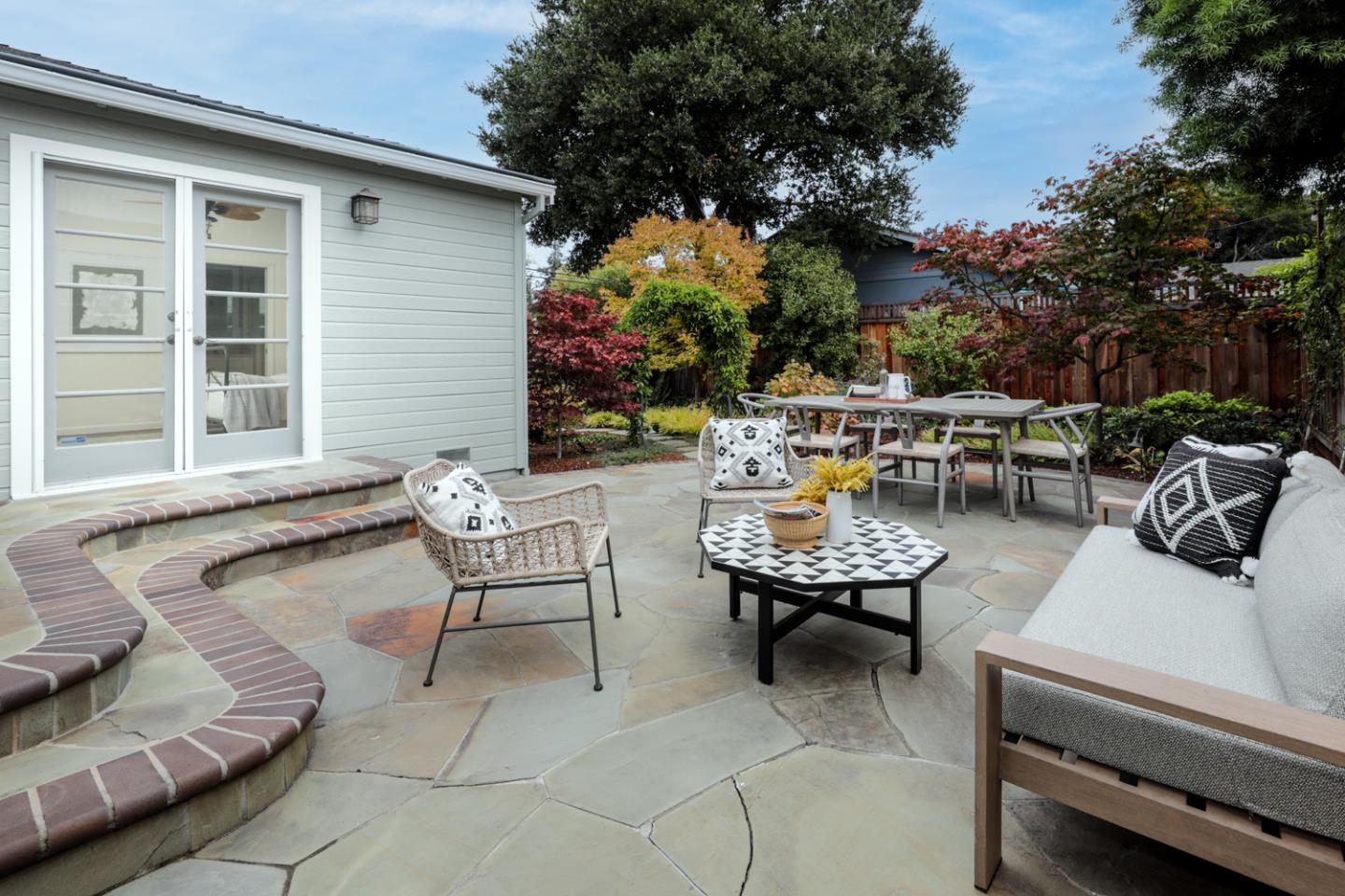 732 Laurel Avenue Menlo Park, CA 94025 - Photo 16 of 22 a view of a patio with couches and a table and chairs with garden view
